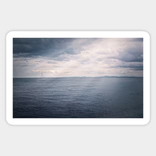 Panoramic seascape with a sailboat on the horizon Sticker